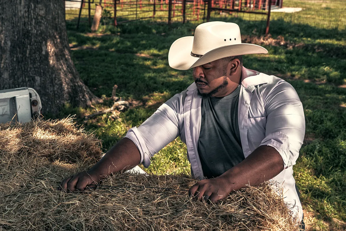 Cowboy working ranch in Texas wearing handmade felt cowboy hat